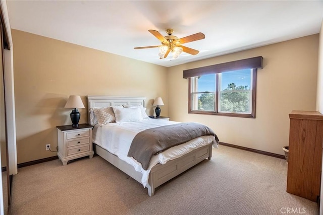 bedroom with light carpet and ceiling fan