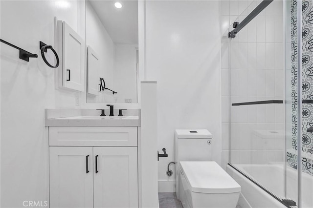 full bathroom featuring toilet, vanity, and shower / bath combination with glass door