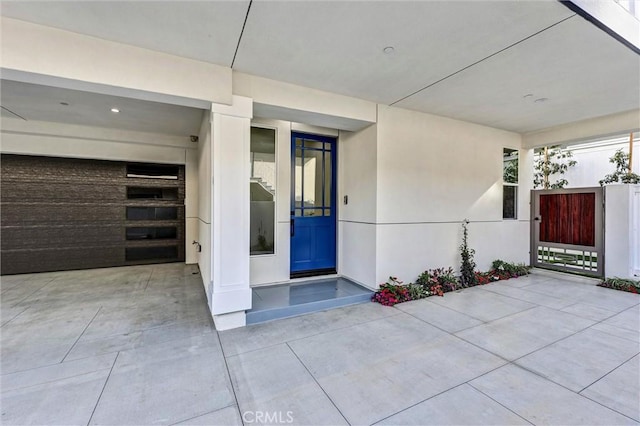 doorway to property featuring a garage