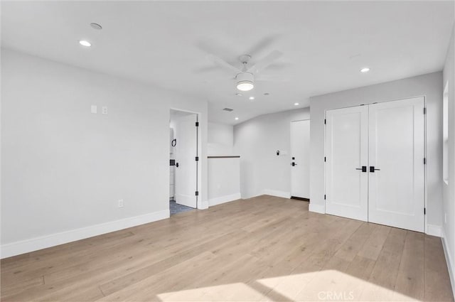 spare room featuring ceiling fan and light hardwood / wood-style flooring