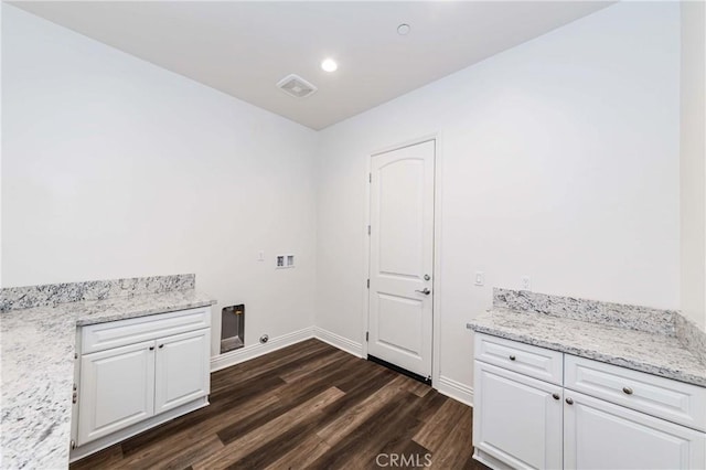 12430 Altura Dr, Rancho Cucamonga, CA 91739 - laundry area with cabinets, hookup for a washing machine, and dark hardwood / wood-style floors