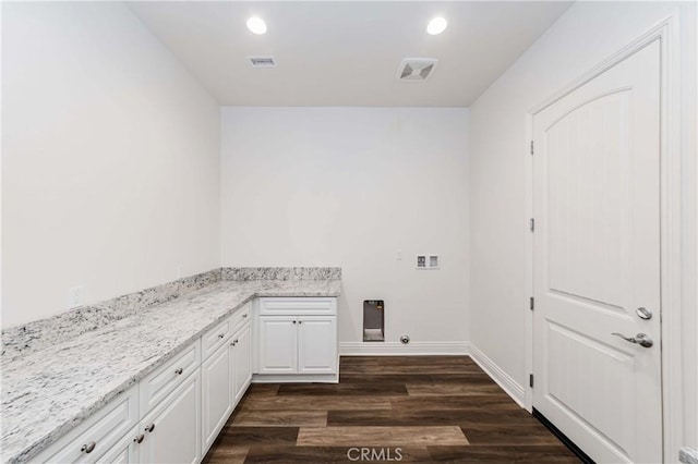 12430 Altura Dr, Rancho Cucamonga, CA 91739 - washroom with dark hardwood / wood-style floors and cabinets