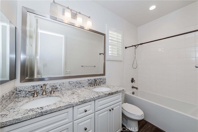 12430 Altura Dr, Rancho Cucamonga, CA 91739 - full bathroom with vanity, wood-type flooring, toilet, and tiled shower / bath