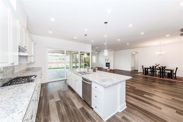 12430 Altura Dr, Rancho Cucamonga, CA 91739 - kitchen featuring white cabinetry, sink, light stone countertops, and an island with sink