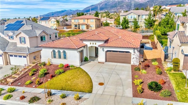 12430 Altura Dr, Rancho Cucamonga, CA 91739 - mediterranean / spanish-style home featuring a mountain view and a garage