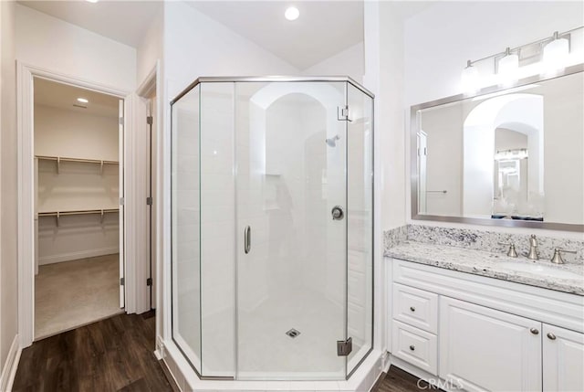 12430 Altura Dr, Rancho Cucamonga, CA 91739 - bathroom featuring wood-type flooring, an enclosed shower, and vanity