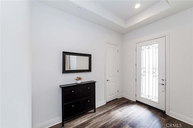 12430 Altura Dr, Rancho Cucamonga, CA 91739 - entryway with a raised ceiling and dark wood-type flooring