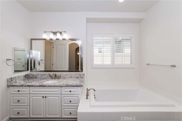 12430 Altura Dr, Rancho Cucamonga, CA 91739 - bathroom with vanity and tiled bath