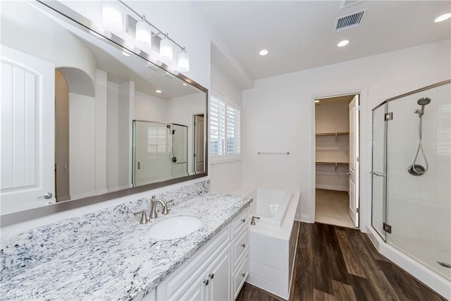 12430 Altura Dr, Rancho Cucamonga, CA 91739 - bathroom with vanity, shower with separate bathtub, and hardwood / wood-style floors