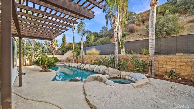 view of pool with a pergola and a patio