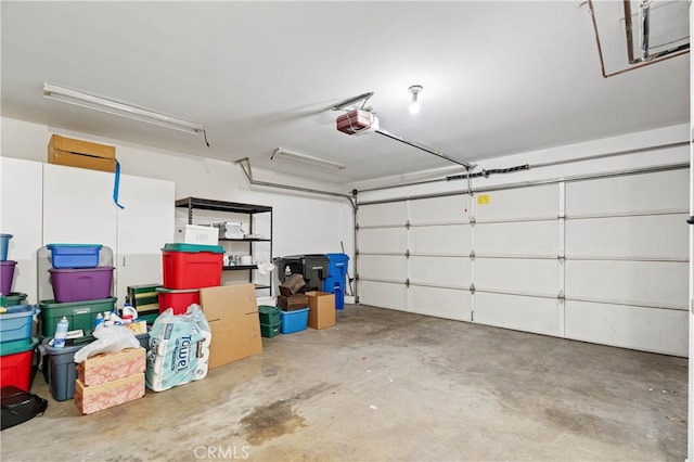 garage featuring a garage door opener