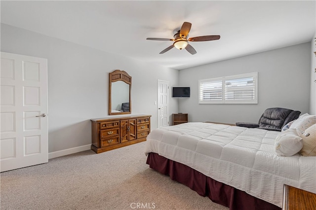 carpeted bedroom featuring ceiling fan and a closet