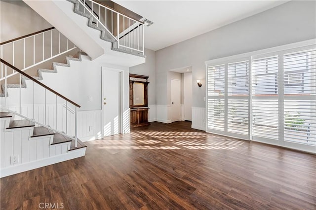 entryway with dark wood-type flooring and a healthy amount of sunlight