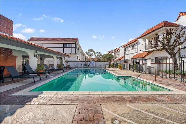 view of swimming pool featuring a patio