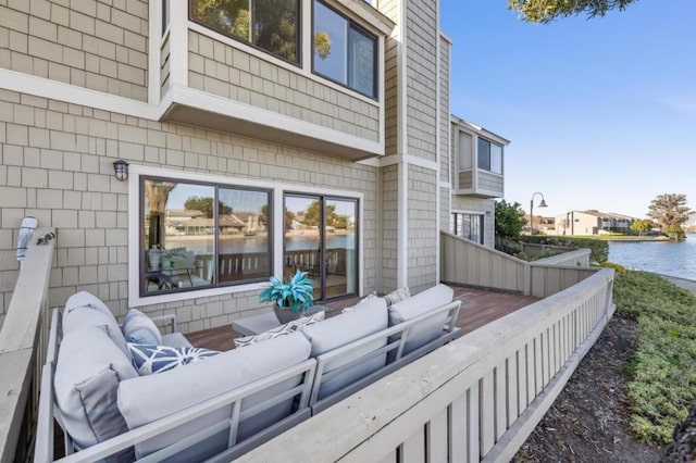 exterior space with outdoor lounge area and a water view