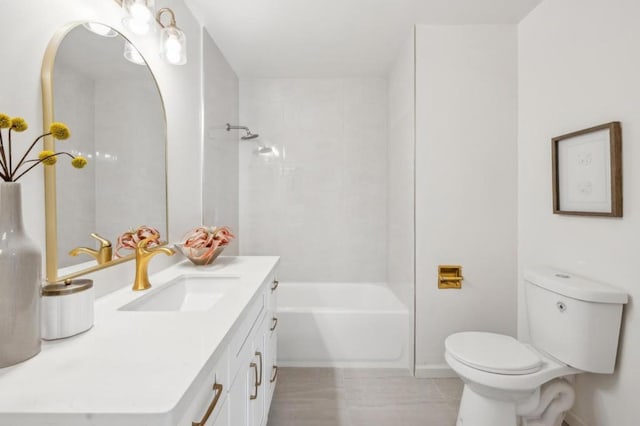 full bathroom featuring vanity, tiled shower / bath combo, tile patterned floors, and toilet