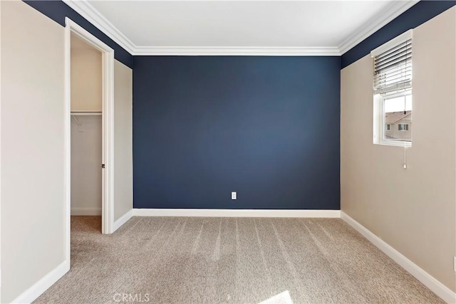 unfurnished bedroom with crown molding, a closet, and carpet flooring