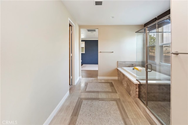 bathroom with tiled tub