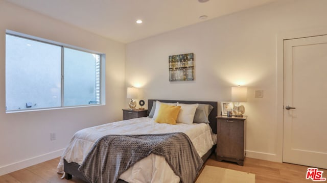 bedroom with light wood-type flooring