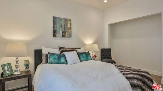 bedroom featuring hardwood / wood-style flooring