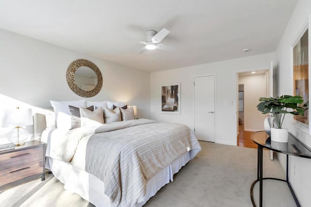 carpeted bedroom with ceiling fan