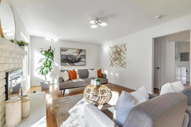 living room with light hardwood / wood-style flooring and electric panel