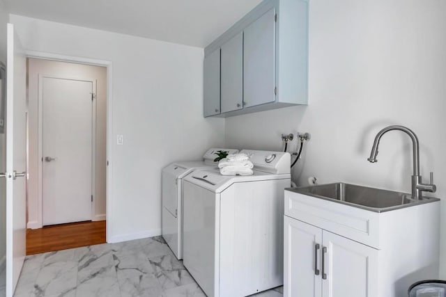 washroom featuring independent washer and dryer, cabinets, and sink