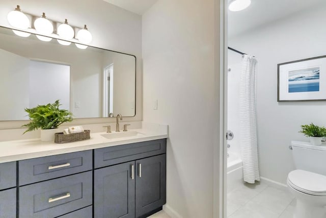 full bathroom with vanity, tile patterned floors, toilet, and shower / bath combo with shower curtain