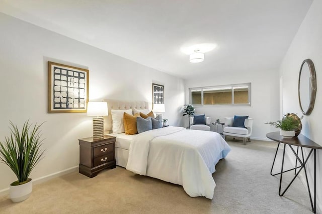 bedroom featuring light carpet