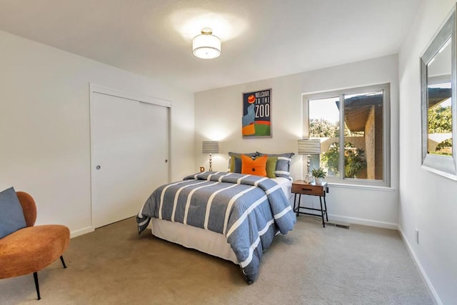 carpeted bedroom featuring a closet