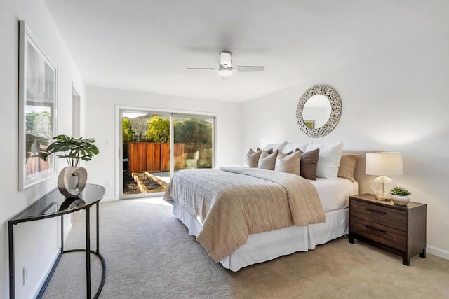 carpeted bedroom featuring ceiling fan and access to exterior