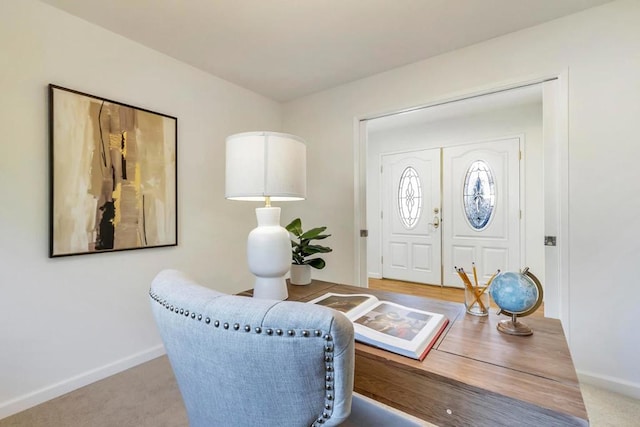 entryway with light colored carpet