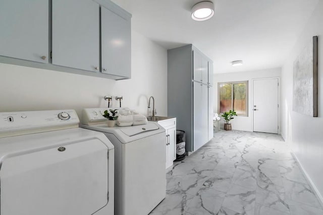 laundry room with cabinets, sink, and washing machine and clothes dryer