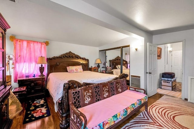 bedroom with wood-type flooring