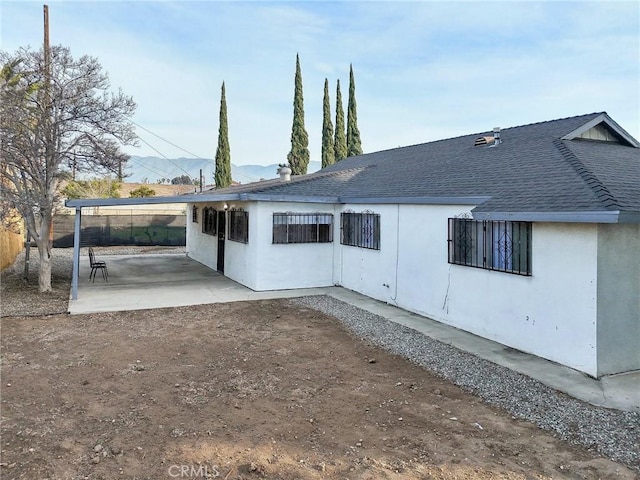 rear view of house featuring a patio