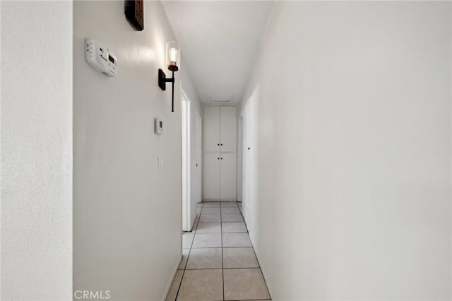 hallway with light tile patterned floors