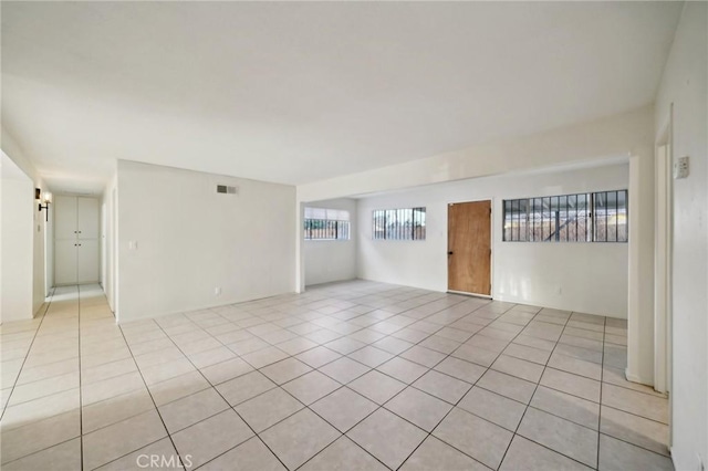 spare room featuring light tile patterned floors