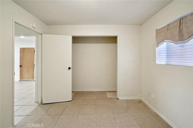 unfurnished bedroom featuring light tile patterned floors