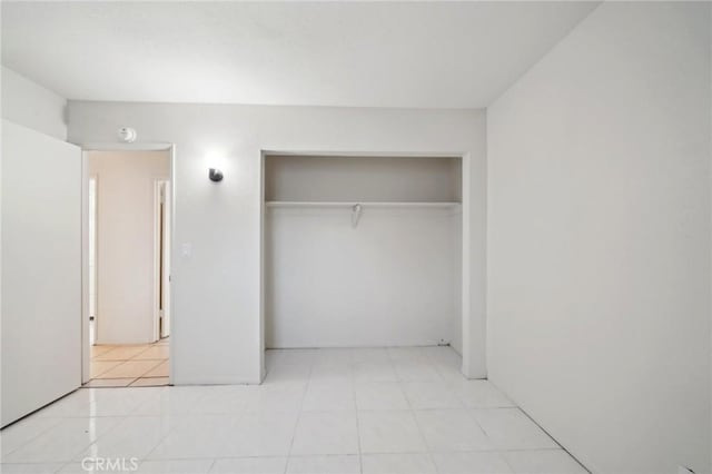 unfurnished bedroom featuring a closet