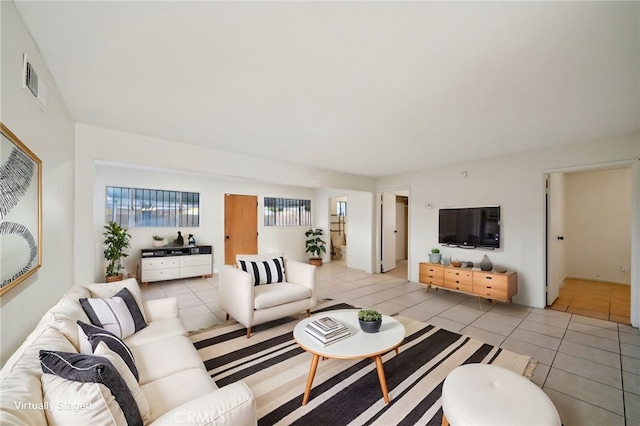 living room with light tile patterned flooring