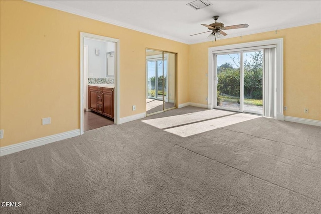 carpeted spare room featuring ornamental molding and ceiling fan