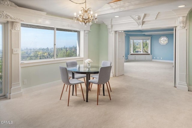 dining space featuring light colored carpet, ornamental molding, and a chandelier