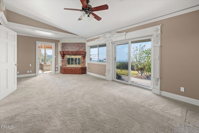 unfurnished living room featuring vaulted ceiling, carpet, and plenty of natural light