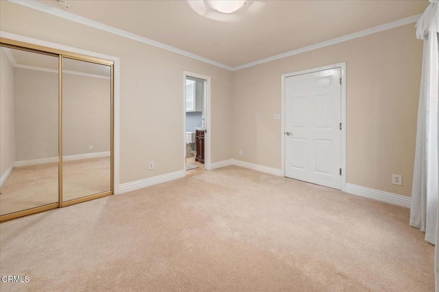 unfurnished bedroom featuring ornamental molding and light colored carpet