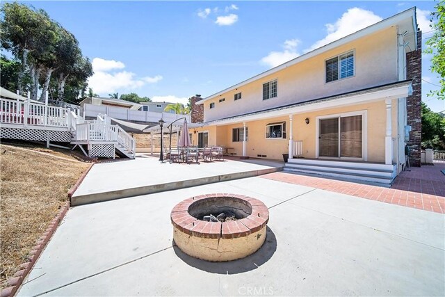 62 Pepper Tree Rd, Chula Vista, CA 91910 - back of house featuring a wooden deck, a patio, and an outdoor fire pit