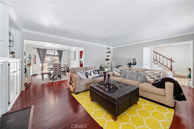 62 Pepper Tree Rd, Chula Vista, CA 91910 - living room with crown molding, an inviting chandelier, and hardwood / wood-style floors