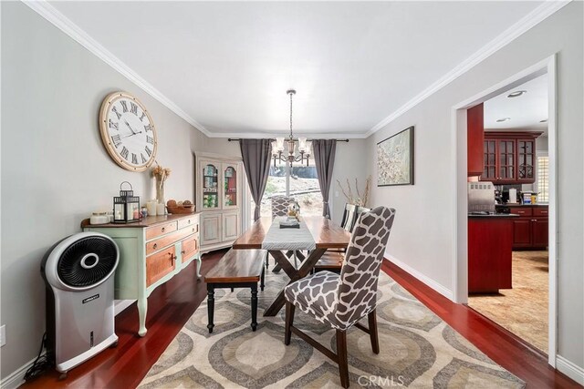 62 Pepper Tree Rd, Chula Vista, CA 91910 - dining room with ornamental molding, dark hardwood / wood-style floors, and a chandelier