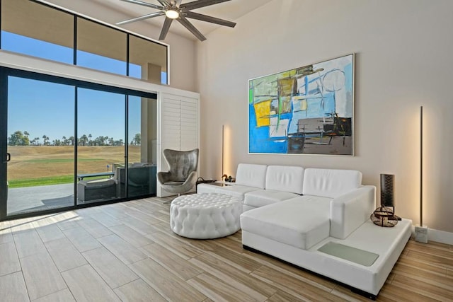 living room featuring a towering ceiling