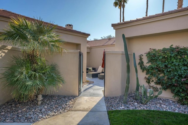 view of property exterior with an outdoor living space