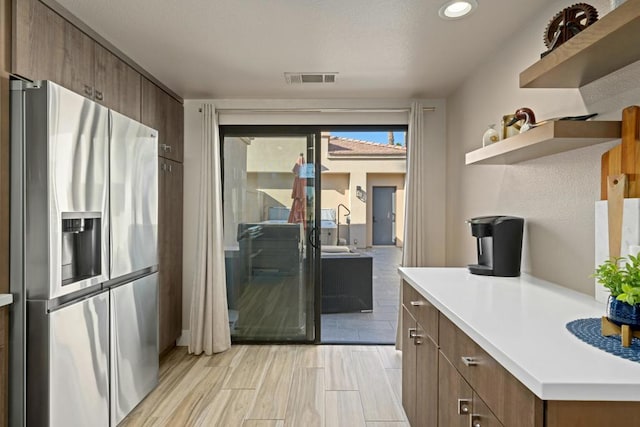 kitchen featuring stainless steel fridge